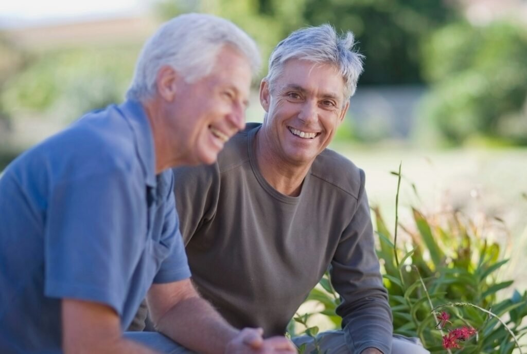 Older men smiling in garden